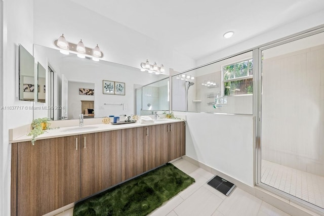 bathroom with vanity, tile patterned flooring, and an enclosed shower