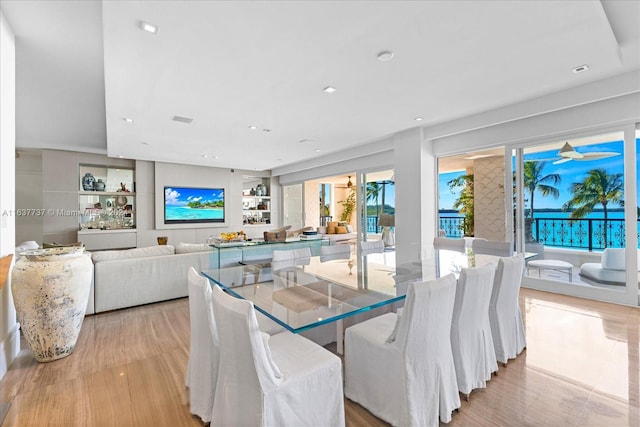 dining space with light hardwood / wood-style flooring