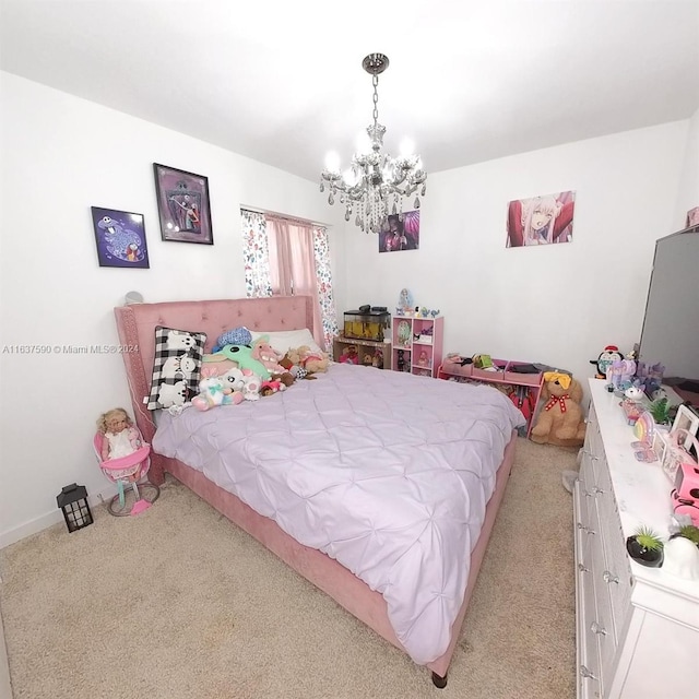 carpeted bedroom featuring a notable chandelier