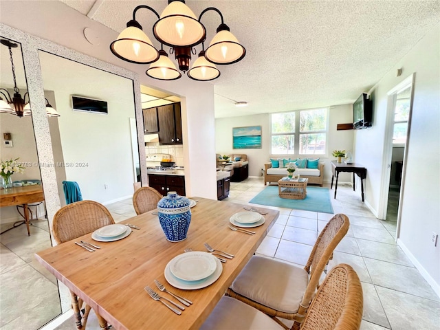 dining space featuring a textured ceiling and light tile patterned flooring