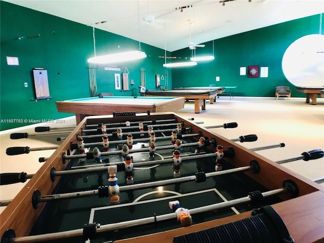 game room with billiards and track lighting