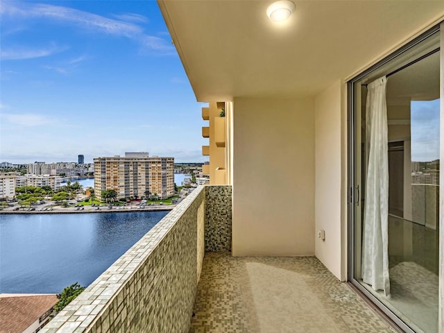 balcony featuring a water view