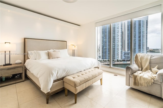 bedroom with light tile patterned floors