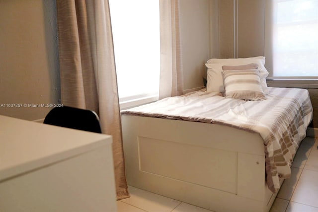 bedroom featuring light tile patterned floors