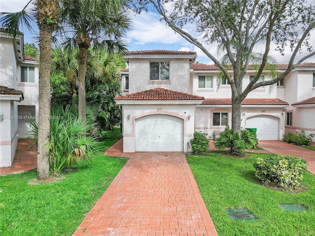 mediterranean / spanish-style house with a front lawn