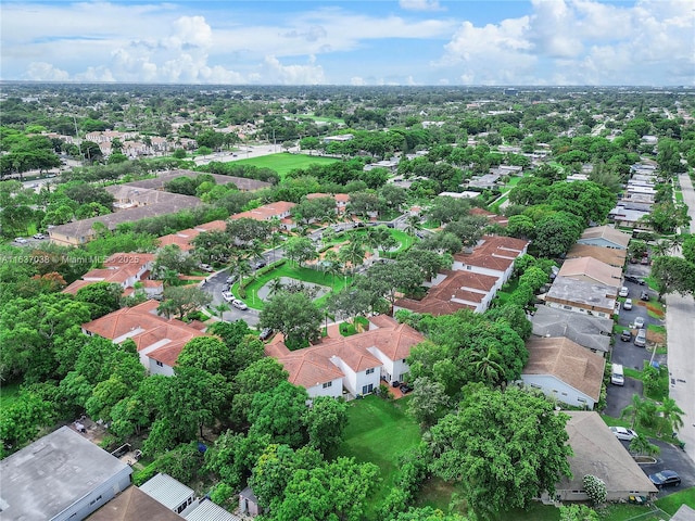 aerial view of property and surrounding area with nearby suburban area