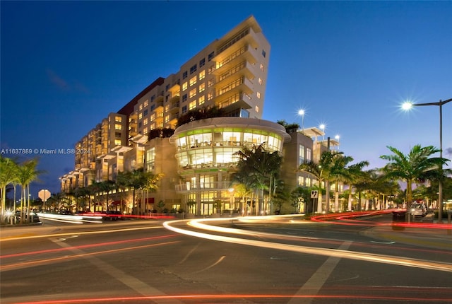 view of outdoor building at dusk