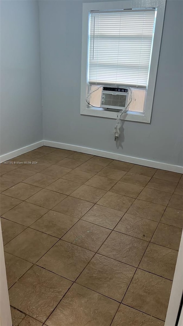 bathroom featuring toilet and a tile shower