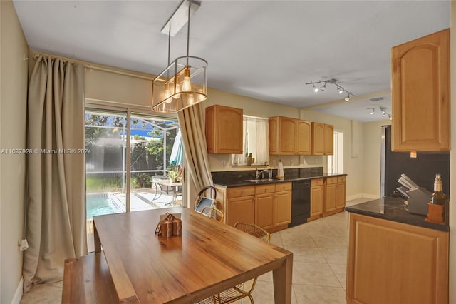 kitchen featuring pendant lighting, dishwasher, an inviting chandelier, sink, and light tile patterned floors