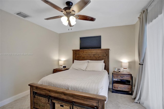 bedroom featuring light tile patterned floors and ceiling fan