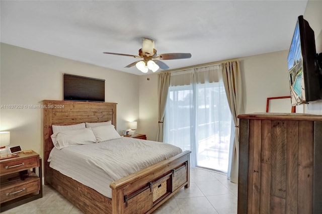 tiled bedroom featuring ceiling fan