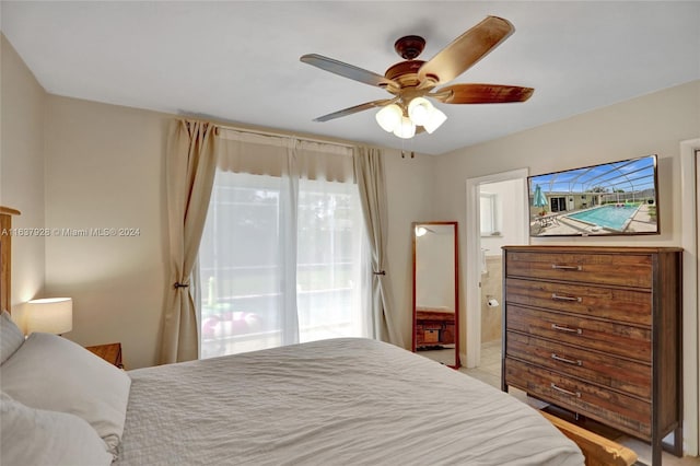 bedroom with ensuite bath and ceiling fan