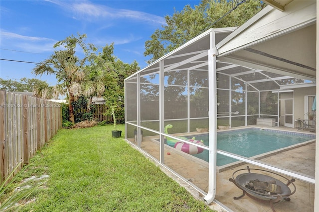 exterior space featuring a patio, a fenced in pool, and a lanai