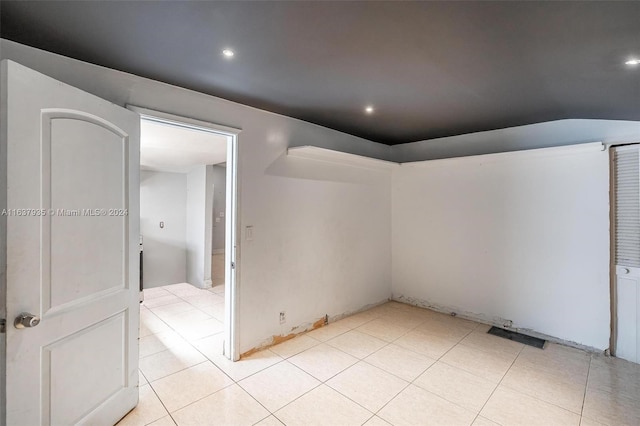 empty room with light tile patterned floors