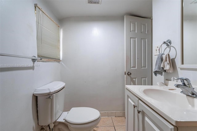 bathroom featuring tile patterned flooring, vanity, and toilet