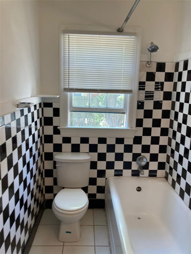 bathroom with tile walls, tile patterned floors, and toilet