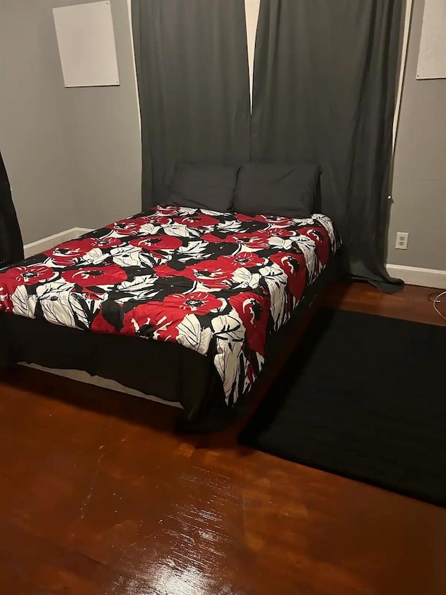 bedroom featuring wood-type flooring