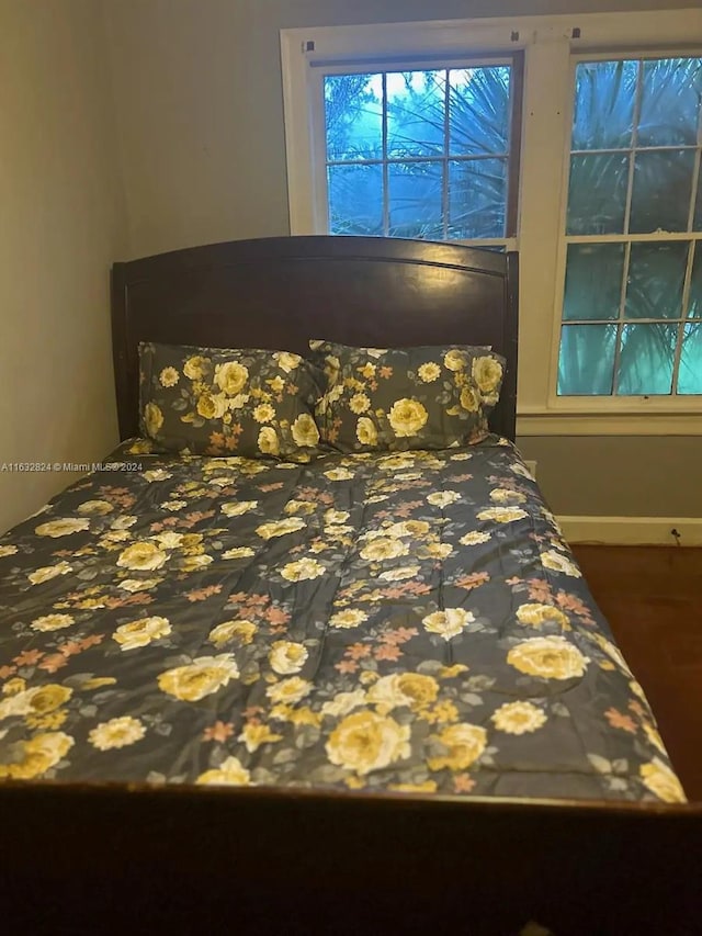 unfurnished bedroom featuring hardwood / wood-style flooring