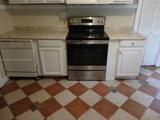 kitchen with stainless steel electric range, white cabinetry, white dishwasher, light stone counters, and light tile patterned floors