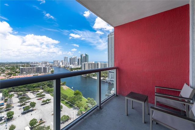 balcony featuring a water view