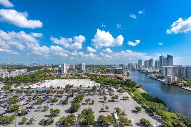 drone / aerial view featuring a water view and a city view