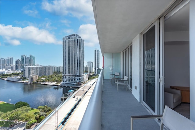 balcony featuring a water view