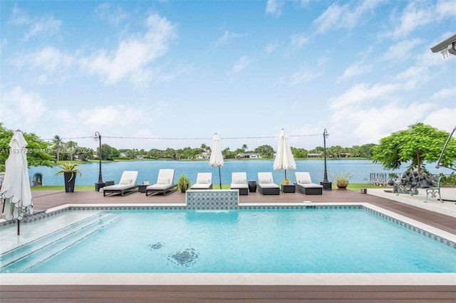 view of pool featuring a patio area and a water view