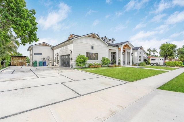 view of front facade featuring a front yard and a garage