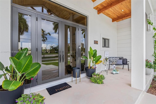 entrance to property with a patio area and french doors