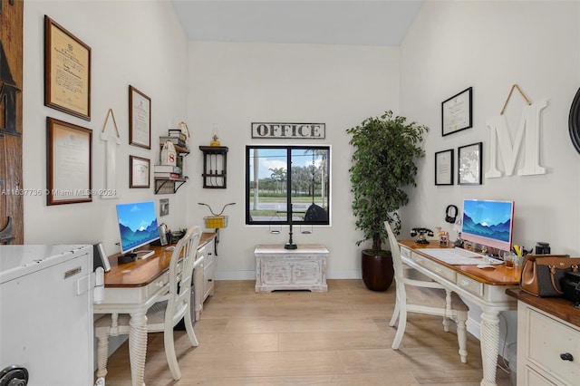 office area with light hardwood / wood-style flooring