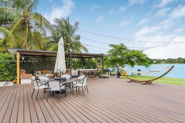 wooden terrace with a water view