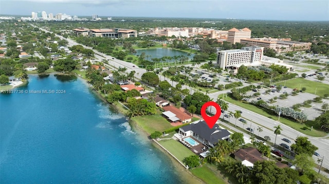 birds eye view of property featuring a water view