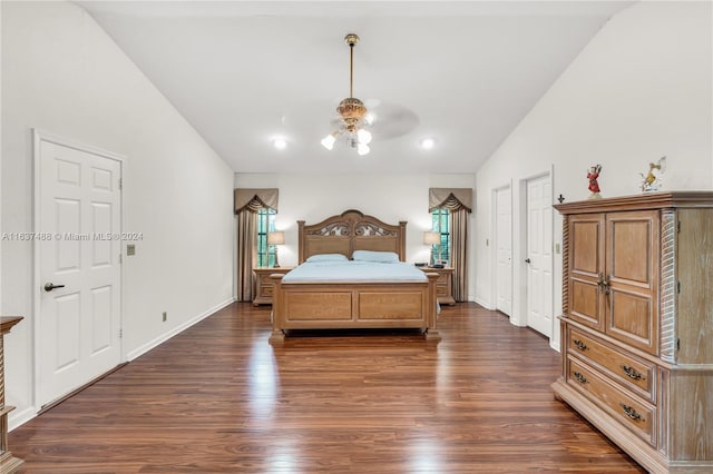 bedroom featuring ceiling fan, dark wood-type flooring, and vaulted ceiling