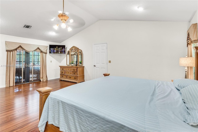 bedroom featuring ceiling fan, vaulted ceiling, and hardwood / wood-style flooring