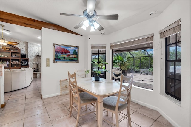 dining room featuring light tile patterned floors, vaulted ceiling, and ceiling fan