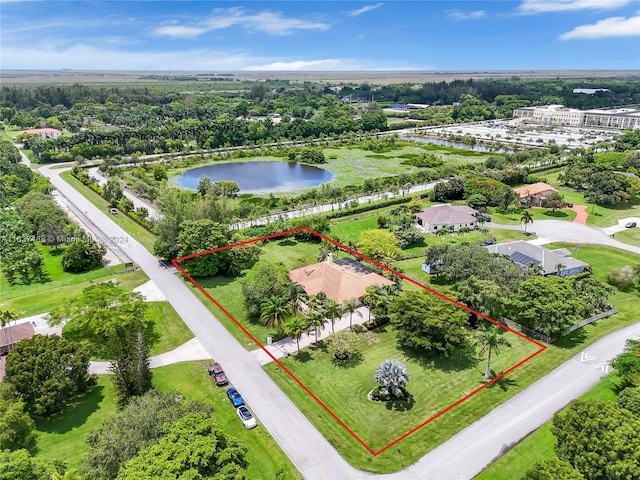 birds eye view of property featuring a water view