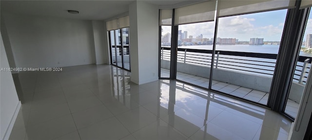 spare room featuring tile patterned flooring