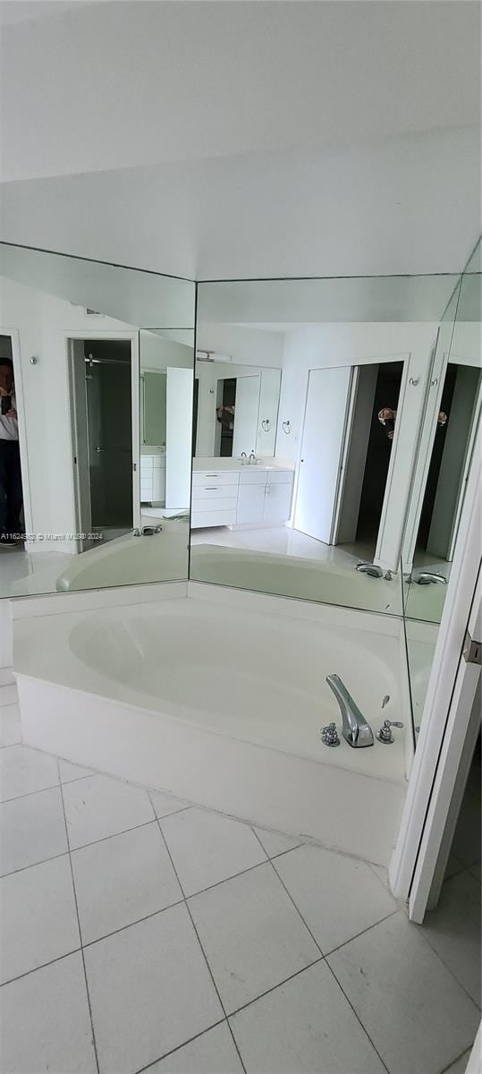 interior space featuring tile patterned floors and a bathing tub