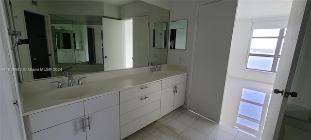 bathroom featuring double vanity and tile patterned floors