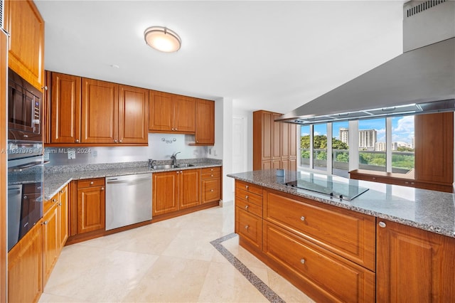 kitchen featuring vaulted ceiling, black appliances, stone counters, sink, and light tile patterned flooring