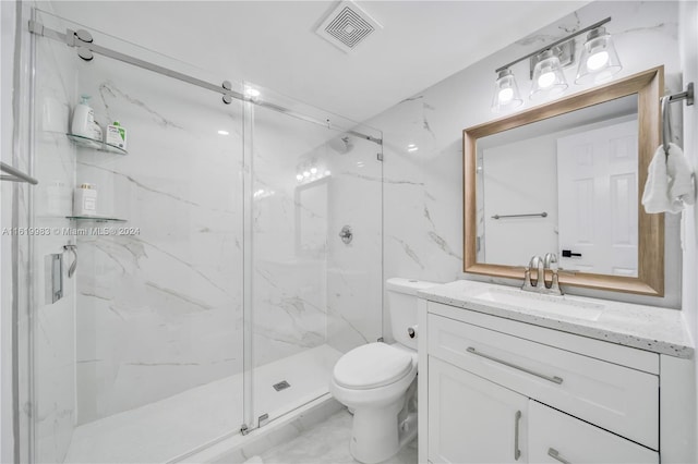 bathroom with a shower with shower door, toilet, tile patterned flooring, and vanity