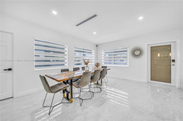 dining area featuring light tile patterned floors