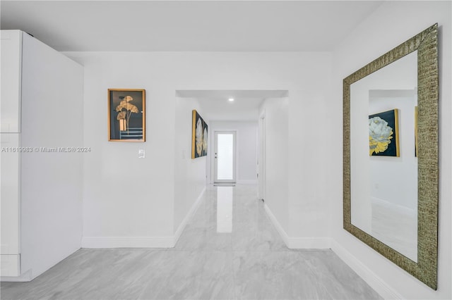 hallway with light tile patterned flooring