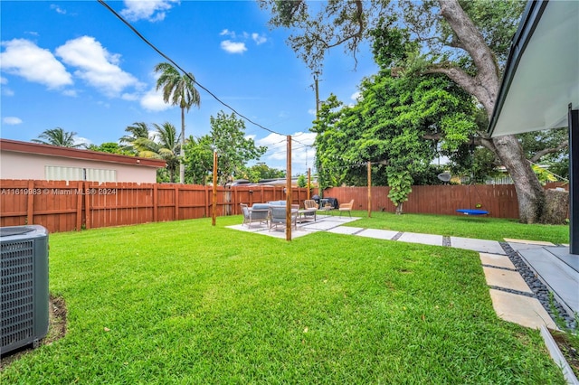 view of yard with a patio area and central AC unit