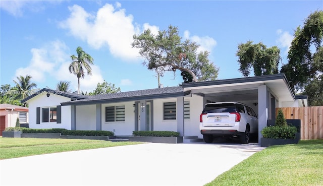 ranch-style house with a front lawn and a carport