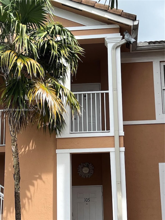 entrance to property with a balcony