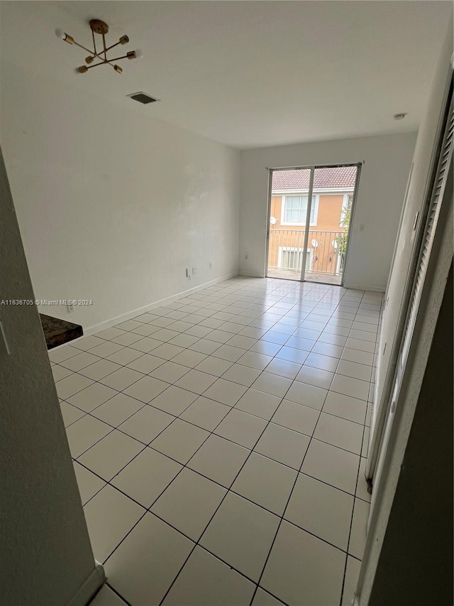 spare room featuring light tile patterned floors