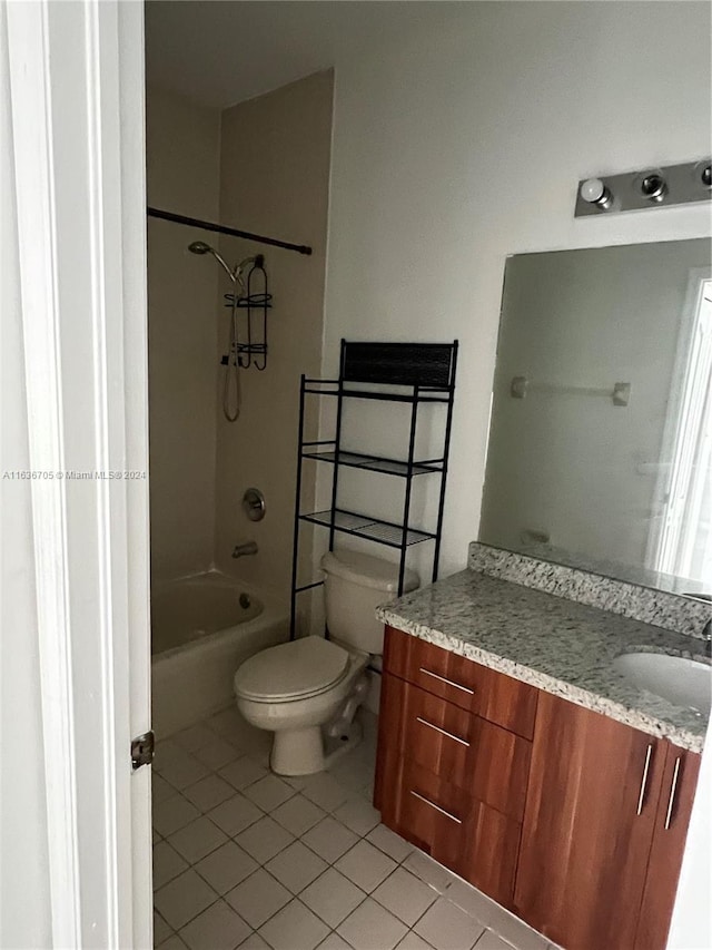 full bathroom with vanity, toilet, tile patterned flooring, and shower / washtub combination