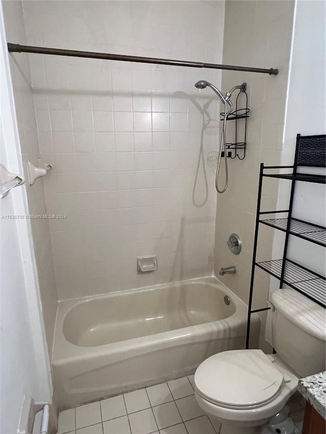 full bathroom with vanity, toilet, tiled shower / bath combo, and tile patterned floors