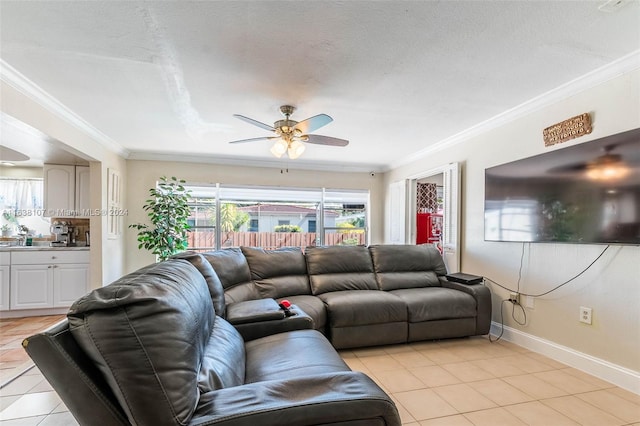 tiled living room featuring crown molding, ceiling fan, and a textured ceiling